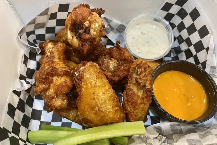 An order of wings from World of Wings, opening July 7, 2021, for delivery out of Olde Bar.