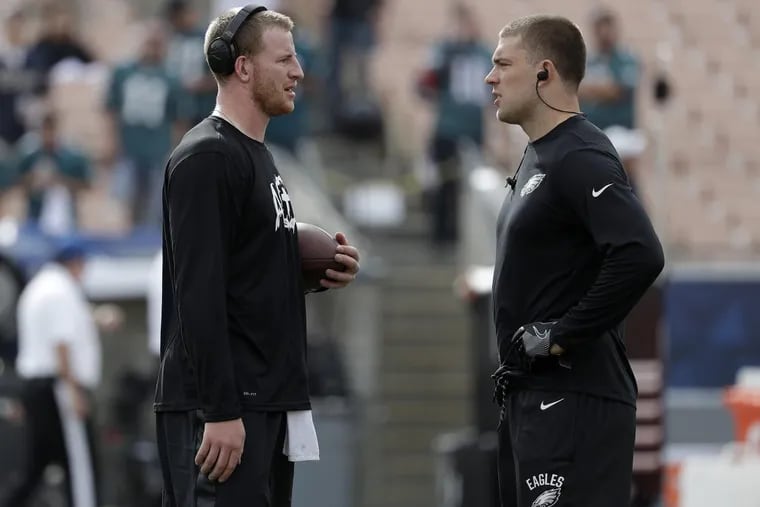 Eagles quarterback Carson Wentz with tight end Zach Ertz during pregame warm-ups before the Eagles play the Los Angeles Rams on Sunday, December 10, 2017. YONG KIM / Staff Photographer