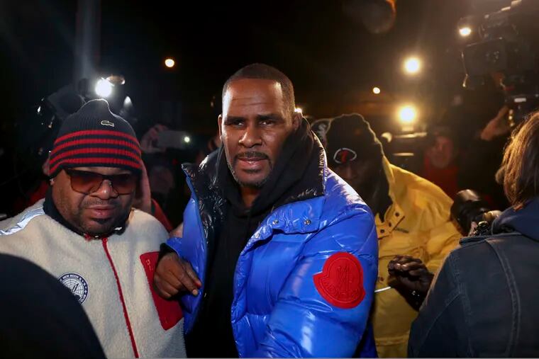 R. Kelly turns himself in at First District police headquarters in Chicago on Friday night, Feb. 22, 2019. (Chris Sweda / Chicago Tribune via AP)
