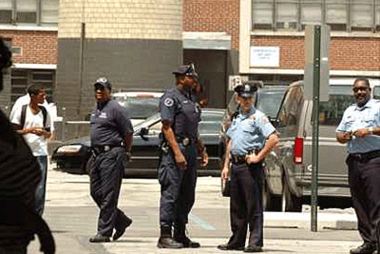 There was a police presence at Strawberry Mansion High School in June, the day after graduation when student Khiry Caldwell, 18, was shot. (Sharon Gekoski-Kimmel / Inquirer)