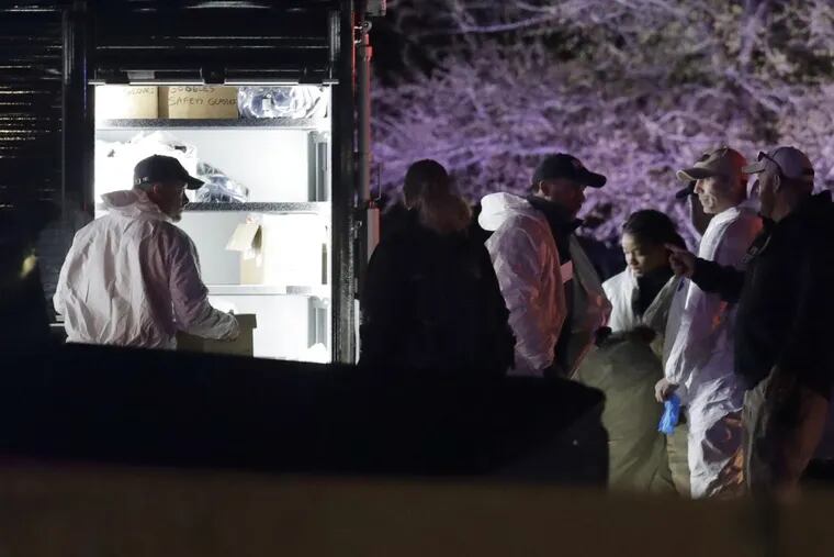 Members of law enforcement stage near the area where a suspect in a series of bombing attacks in Austin blew himself up as authorities closed in, Wednesday, March 21, 2018, in Round Rock, Texas.