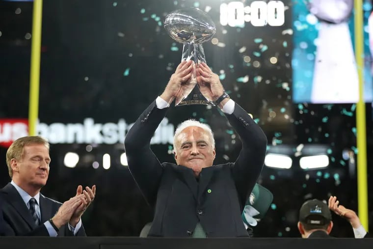 Eagles owner Jeffrey Lurie hoists up the Lombardi trophy after Super Bowl LII, at U.S. Bank Stadium in Minneapolis, Minnesota, Sunday, Feb. 4, 2018. The Eagles won 41-33.