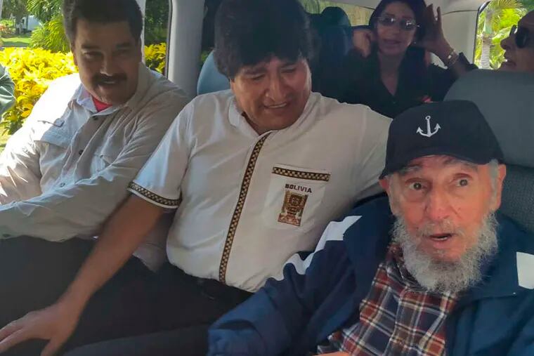 Venezuelan President Nicolas Maduro (left) and Bolivian President Evo Morales sit in a van with Fidel Castro as they celebrate his 89th birthday.