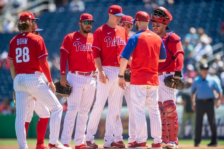 Philadelphia Phillies starting pitcher Kyle Gibson (44) gather at the mound, during the 2nd inning of a spring training baseball game against the New York Yankees, Friday, March 25, 2022, in Clearwater, Fla.