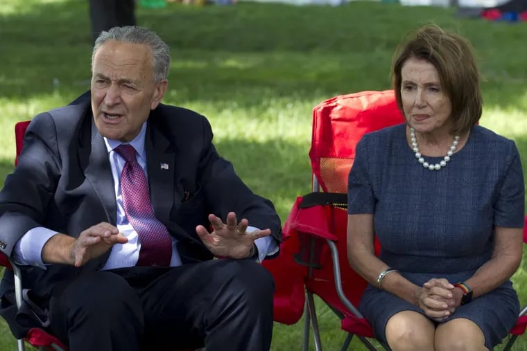 Chuck Schumer and  Nancy Pelosi speak with people Thursday who are holding a four-day fast on Capitol Hill.