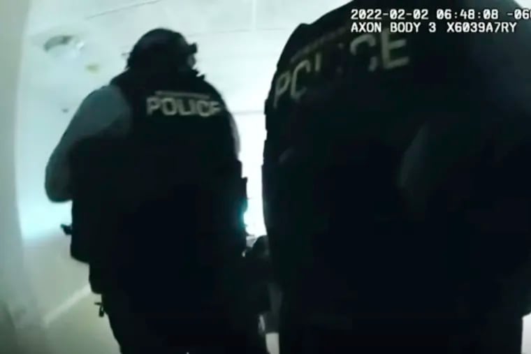 In this image taken from Minneapolis Police Department body-cam video and released by the city of Minneapolis, police enter an apartment on Wednesday moments before shooting 22-year-old Amir Locke. Minneapolis Mayor Jacob Frey has imposed a moratorium on no-knock warrants after Locke was killed as a SWAT team carried out a search warrant in a downtown apartment.