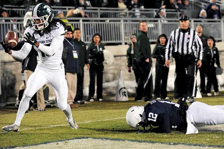 Michigan State Spartans cornerback Trae Waynes (15) intercepts a pass intended for Penn State Nittany Lions wide receiver Chris Godwin (12).  (Evan Habeeb/USA TODAY Sports)