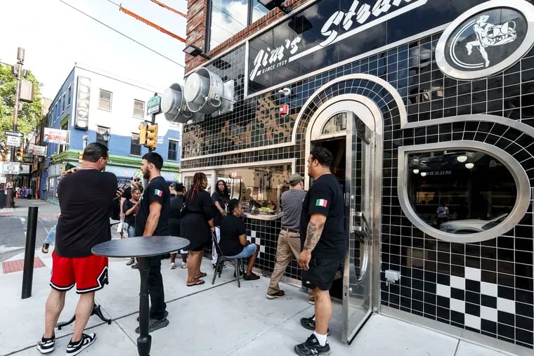 A scene not seen since July 2022: A crowd around Jim's Steaks at Fourth and South Streets. A preopening party Monday helped test the kitchen before the opening Wednesday.
