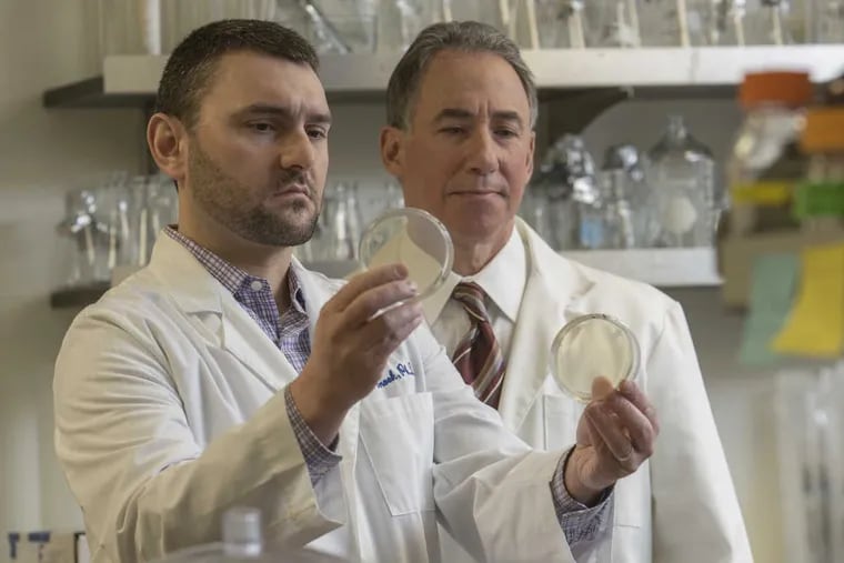 Thomas Jefferson University researchers Adam Snook (left) and Scott Waldman are developing a colon cancer treatment vaccine to prevent metastatic disease.