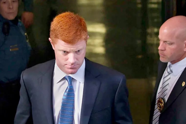 Mike McQueary leaves the Dauphin County Courthouse. (Photo: Associated Press)