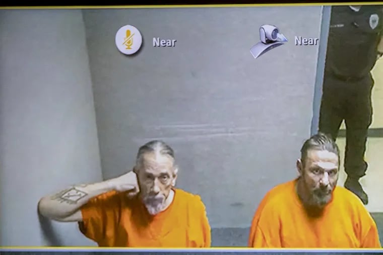 Ferdinand Augello, left, and Paul Pagano, right, wait, via video, for their first court appearance to begin at the Atlantic County Courthouse on January 11, 2018. Both are charged in the case of James Kauffman, who is charged with having his wife murdered in 2012 and running a drug ring out of his office. MICHAEL BRYANT/ Staff Photographer