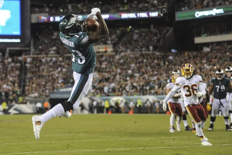 Eagles wide receiver Nelson Agholor makes a leaping catch for a 10-yard touchdown Monday night against the Redskins.