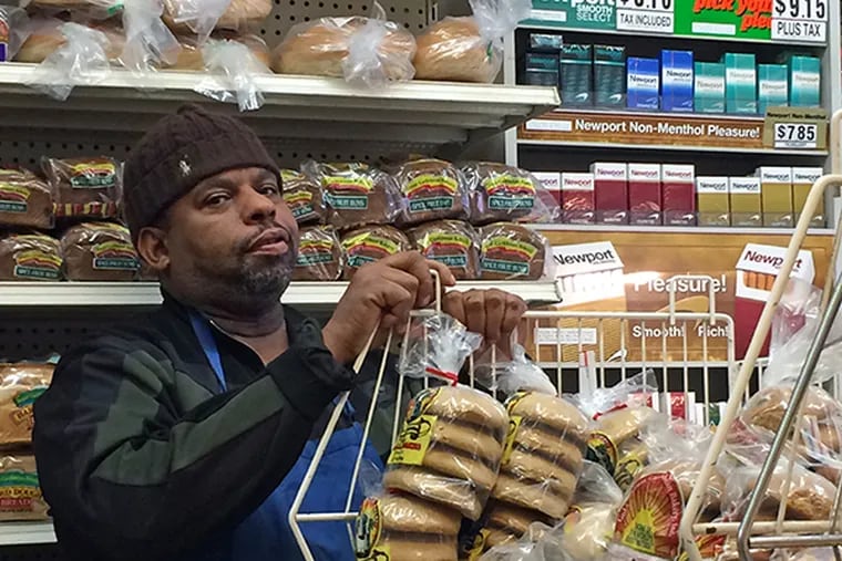 Travis Leslie, a clerk at Pats Caribbean Market in Mt. Airy, commented about significant sales declines because of the tax. (Staff Photo by Jason Laughlin)