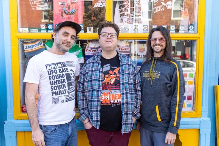 Owners of South Fellini Tony Trov (left) and Johnny Zito (right) pose for a portrait with Philadelphia comedian Bryan Bierman at the South Fellini shop in Philadelphia.
