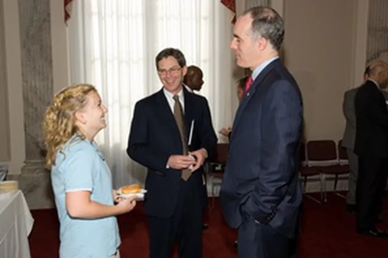 Sen. Bob Casey (right) spends times with constituents Jessica Tramaglini of Penn State and Wayne Kenefick of Graymont Ltd.