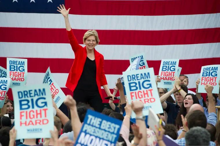 In this May 16, 2019, photo, Democratic presidential candidate Sen. Elizabeth Warren, D-Mass., addresses a campaign rally at George Mason University in Fairfax, Va. Warren is gaining traction with black women debating which Democratic presidential candidate to back in a historically diverse primary.