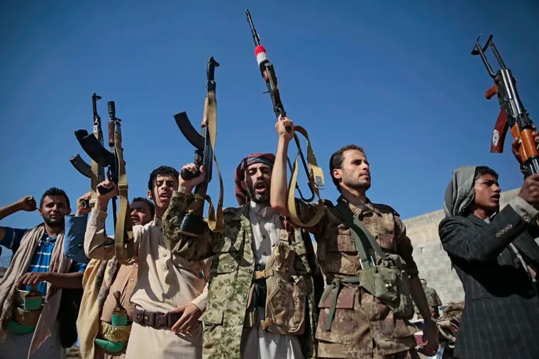 In this Dec. 13, 2018, file, photo, tribesmen loyal to Houthi rebels hold up their weapons as they attend a gathering to show their support for the ongoing peace talks being held in Sweden, in Sanaa, Yemen. The United Nations has cast doubt on the claims by Yemen’s Shiite rebels to have withdrawn from the port of Hodeida, saying such steps can only be credible if all other parties can verify them.(AP Photo/Hani Mohammed, File)