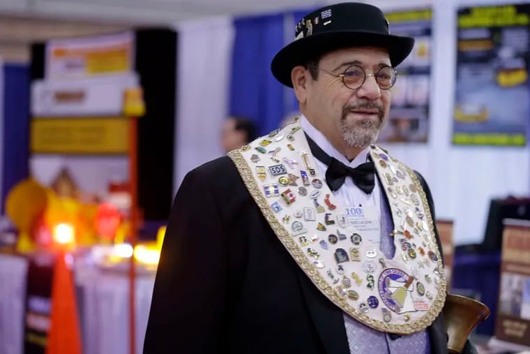 Rich LaLena, official crier of the N.J. State League of Municipalities, walked through an exhibition hall at the group's annual conference last week in Atlantic City.