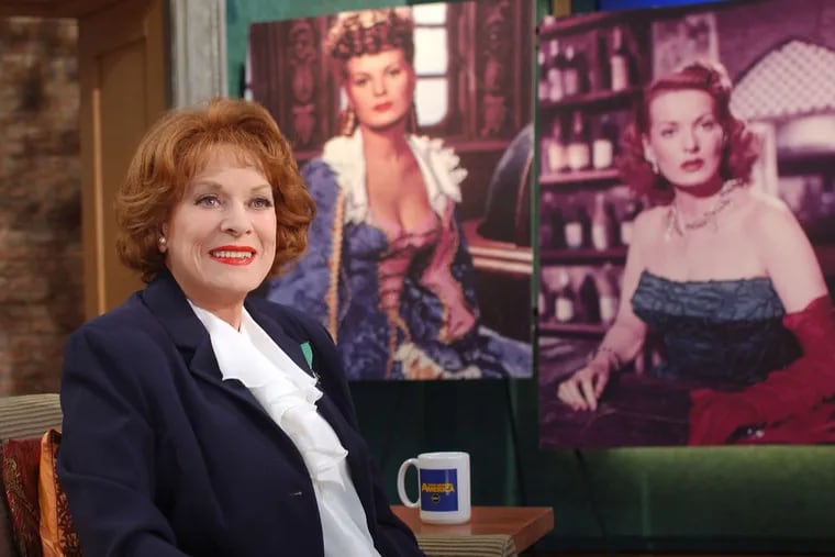 Maureen O'Hara, in a &quot;Good Morning America&quot; TV appearance in 2004. In the background are photos from her screen roles.