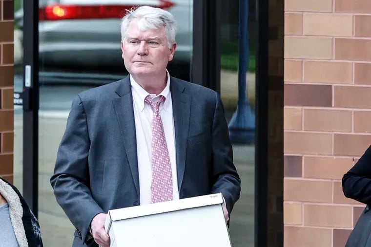 John Dougherty leaves court last week in Reading.