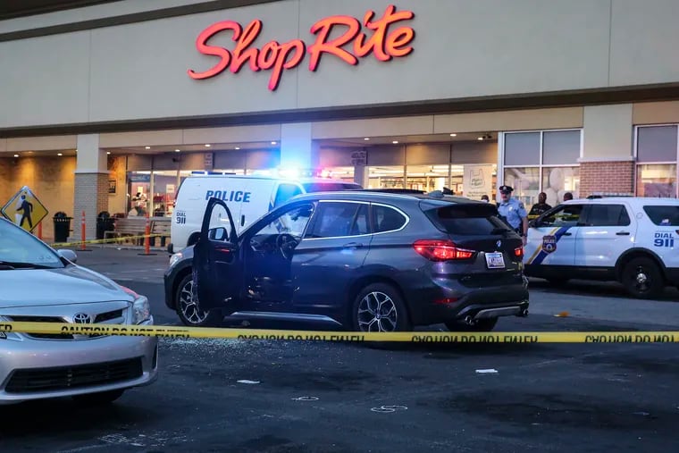 Police on the scene in the parking lot of the ShopRite on East Olney Avenue where a man and woman were shot the man fatally in a BMW SUV in the parking lot.  Monday, August 16, 2021