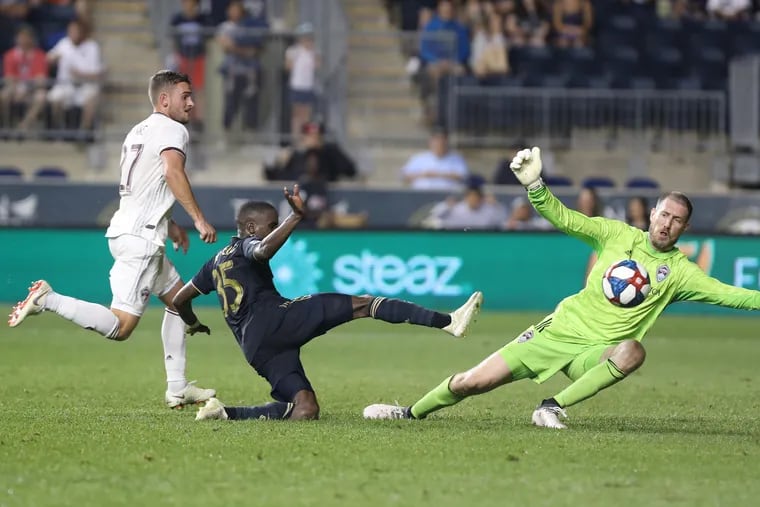 Goal keeper Clint Irwin, right, of the Colorado Rapids is able to deflect a shot by Jamiro Monteiro, center, of the Philadelphia Union late in the game at Talen Energy Stadium on May 29, 2019.  Delkan Wynne is left.