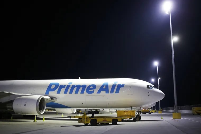 An Amazon.com Prime Air cargo jet sits at the DHL Worldwide Express hub of Cincinnati/Northern Kentucky International Airport.