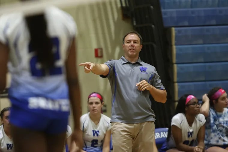 Coach Chris Sheppard with his Williamstown volleyball team at a match against Shawnee.