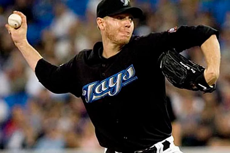Although it seems the Phillies aren't interested, Roy Halladay remains a trade option. (AP Photo/The Canadian Press,Darren Calabrese, File)
