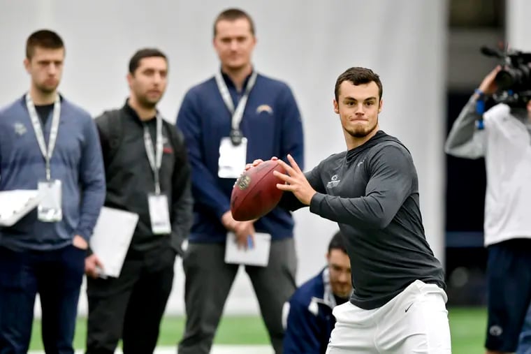 NFL personnel watch as Trace McSorley throws during Pro day on Tuesday, March 19, 2019 at Holuba Hall in State College, Pa. (Abby Drey/Centre Daily Times/TNS)