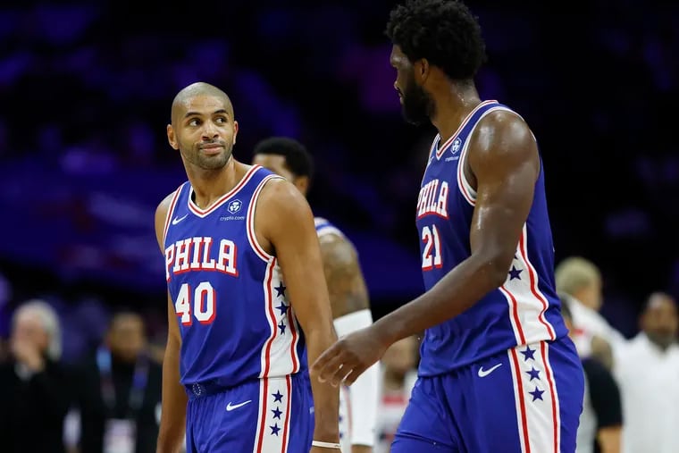 Sixers forward Nicolas Batum (40) with center Joel Embiid during the rout of the Washington Wizards on Monday.