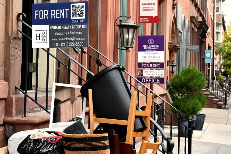 Discarded furniture and signs for homes and an office for rent in Center City in 2021. A report by Community Legal Services and the Housing Initiative at Penn found that many tenants owe back rent and that those who have been evicted face challenges finding housing.
