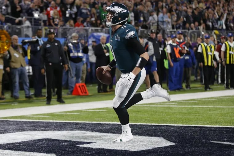 Nick Foles runs untouched into the end zone on a trick play, a pass from Trey Burton.