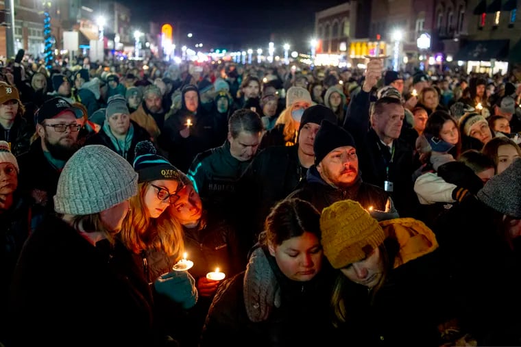 A candlelight vigil Friday in Oxford, Mich., after a 15-year-old sophomore opened fire at his high school, killing four students.