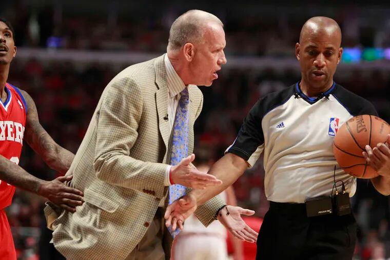 Doug Collins argues with official Derrick Stafford while Lou Williams tries to pull the coach away. The Sixers will attempt to even the series on Tuesday in Chicago. RON CORTES / Staff Photographer