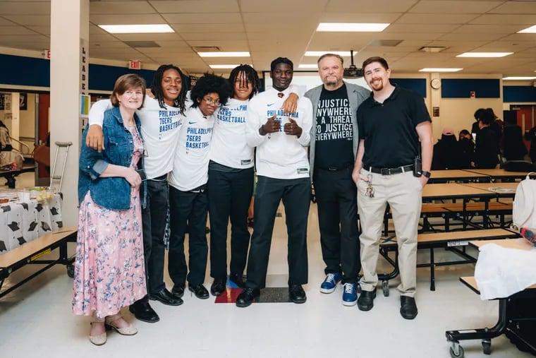 Sixers president of basketball operations Daryl Morey poses with the Camden Academy table tennis team, including math teacher and club adviser Alla Lantsman (left), who serves as vice president of the West Jersey Table Tennis Club.