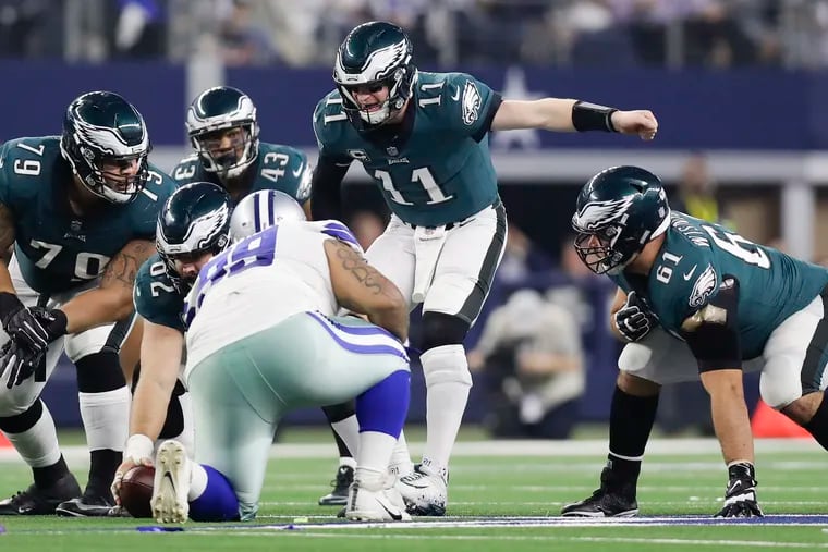 Eagles quarterback Carson Wentz yelling instructions to his offensive line the last time the Eagles played at Dallas, in December.