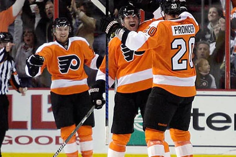 Scott Hartnell (center) and Chris Pronger were responsible for the Flyers' game-winning goal. (Yong Kim/Staff Photographer)