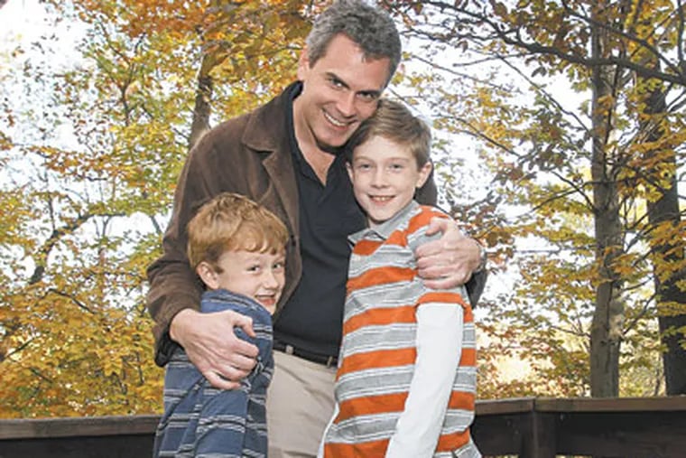Chris Morris, above, with sons Vance, 6, and Mick, 11. (MICHAEL S. WIRTZ / Staff Photographer)