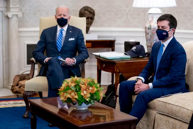 President Joe Biden and Transportation Secretary Pete Buttigieg meet with Vice President Kamala Harris and members of the House of Representatives in the Oval Office earlier this month.