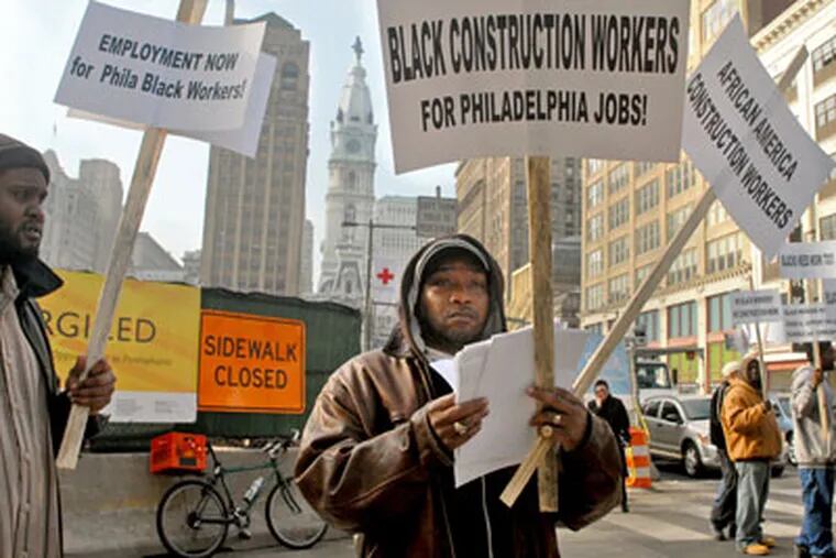 African American construction workers, including Rashime Sibert-Bey (left) and George Sibert, conduct an informational picket near the Convention Center construction site.  (Tom Gralish / Staff Photographer)