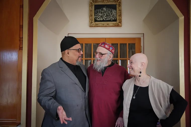 Imam Abdul-Halim Hassan (left) talks with Rabbi Arthur Ocean Waskow (center) and his wife, Rabbi Phyllis Ocean Berman at Masjidullah Mosque in Philadelphia. The mosque will host a 50th anniversary Freedom Seder on April 7.