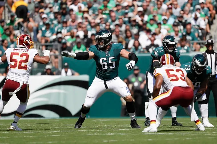 Eagles offensive tackle Lane Johnson keeps an eye on Redskins linebacker Ryan Anderson (52) in Sunday's 32-27 win.