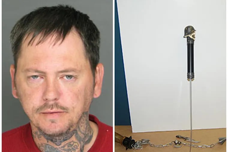 George Rogers, left, is accused of attacking an Upper Darby police officer with weaponry.  Right: Samurai knife, replete with Nazi insignia and skull on top. Rogers was charged with attempted murder.