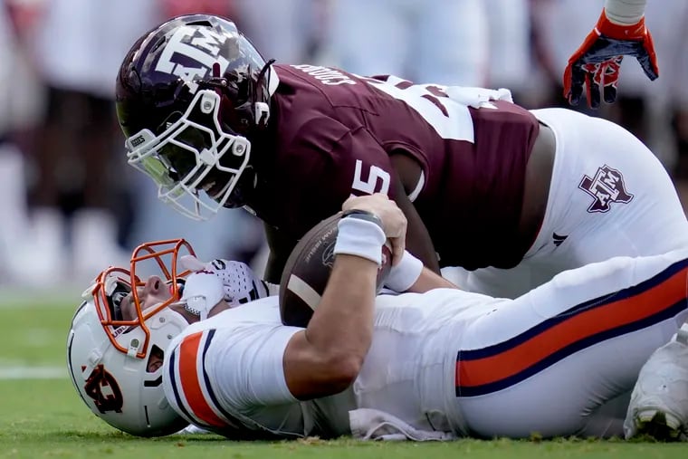 Texas A&M linebacker Edgerrin Cooper (45) gets in the face of Auburn quarterback Payton Thorne (1) after stopping him for a short gain on a run during the first quarter of an NCAA college football game Saturday, Sept. 23, 2023, in College Station, Texas. (AP Photo/Sam Craft, File)