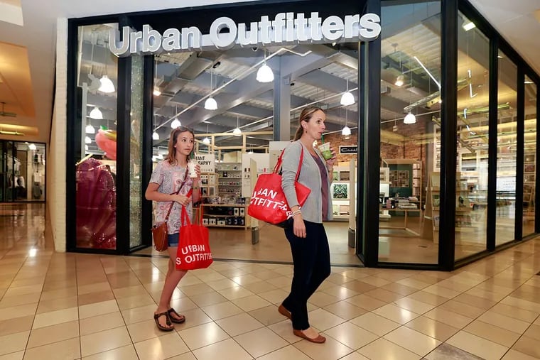Michelle Koch and her daughter Isabella, 12, leave Urban Outfitters at the King of Prussia Mall.