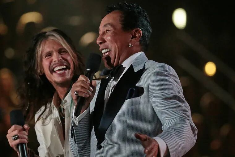 Steven Tyler and Smokey Robinson on stage to present at the 56th Annual Grammy Awards at Staples Center in Los Angeles on Sunday, Jan. 26, 2014.