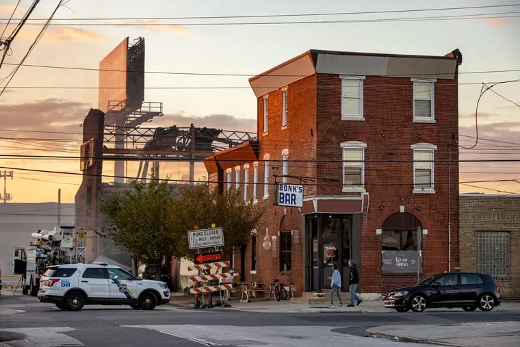 Bonk's Bar, at the corner of Richmond and Tioga Street, is less than a block from a multialarm warehouse fire that started Sunday. The morning after, the bar's owner credited the Philadelphia Fire Department and winds for saving the bar.
