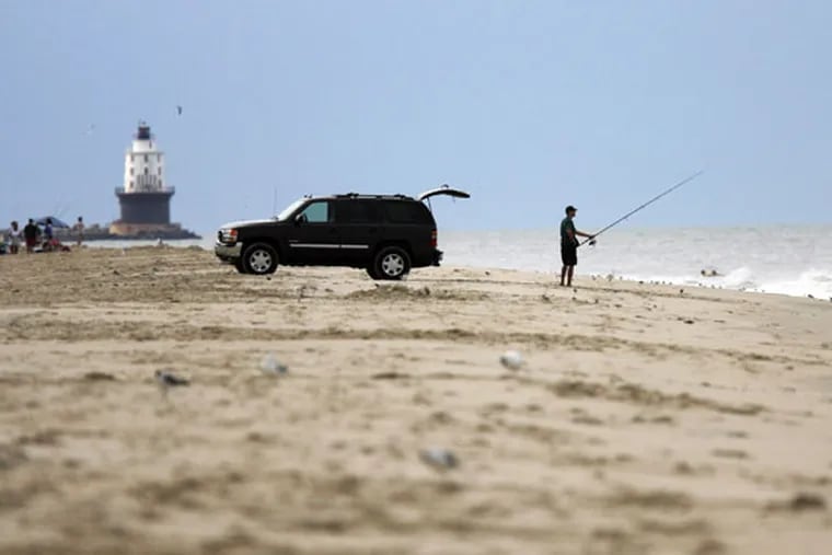 A fisherman casts his line on the Herring point beach in the Cape Henlopen State Park. (Tim Shaffer / File photo)