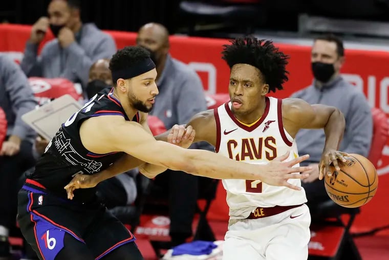 Sixers guard Ben Simmons defends Cleveland Cavaliers guard Collin Sexton on Feb. 27.